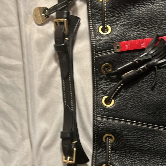 Dooney & Bourke Drawstring bag with tassels and duck tag. - Picture 7 of 12